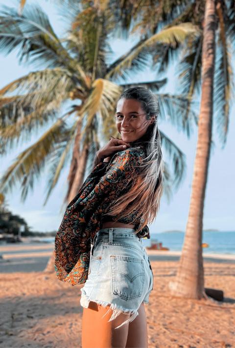 Sophie among the palms on a tropical beach